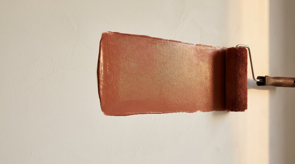 Roller_applying_paint_to_wall_202608131541